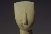 Female figure with folded arms